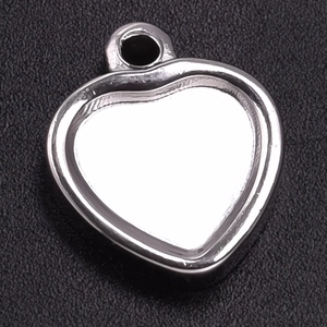 Detailed view of silver heart-shaped 304 stainless steel pendant base with hole