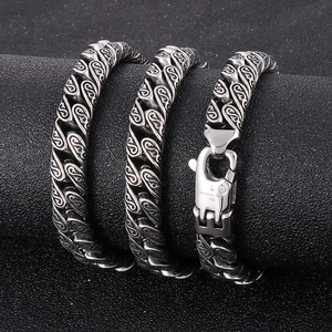 Punk vintage stainless steel Cuban link bracelet with diamond buckle on black texture