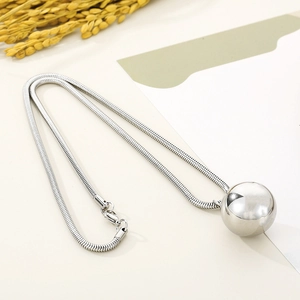 Silver snake chain necklace featuring a minimalist polished sphere pendant for women