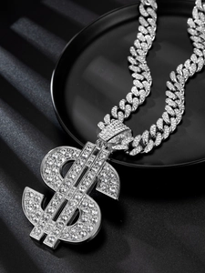 Macro shot of silver Cuban link chain with a large iced-out dollar sign pendant detail