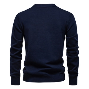 Back view of a navy blue V-neck knit cardigan with ribbed cuffs and hem on white background