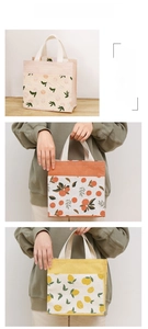 Detail showing canvas lunch bags with pink leaves, orange citrus, and yellow lemon prints
