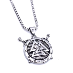 Macro detail of silver Valknut shield pendant with crossed swords and steel chain