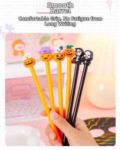 Close-up of Halloween gel pens featuring 3D pumpkin and ghost silicone toppers