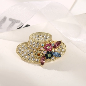 Elegant hat-shaped gold brooch with sparkling rhinestones and colorful crystal floral accents