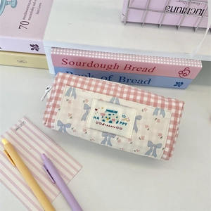 Pink checkered pencil case with cute floral pattern and Happy embroidery patch detail