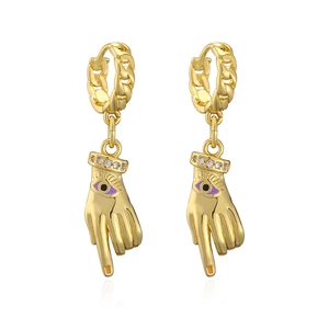 Close-up of gold plated hand drop earrings featuring purple evil eye and zircon stones