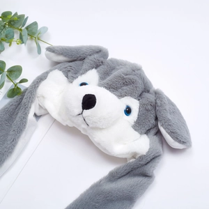 Close-up of plush husky hat with moving ears, soft grey and white faux fur detail