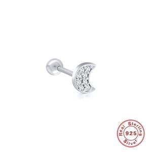 Macro view of moon-shaped sterling silver stud earring with white zircon inlay