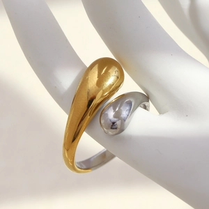 Detailed close-up of dual-tone teardrop open ring in gold and silver finish