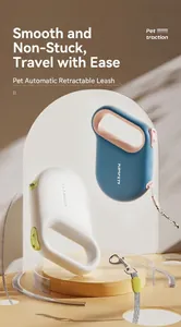 Detail view of ergonomic D-shaped handles and flat nylon leash for the retractable pet lead