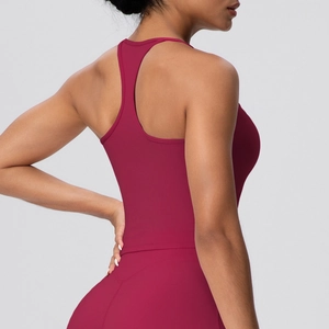 Close-up of wine red racerback yoga top with high-stretch fabric and seamless design