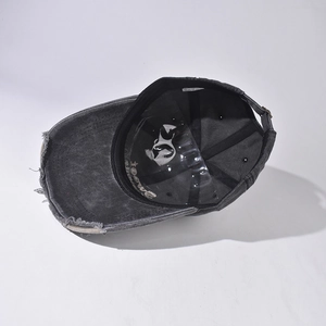 Top view of washed grey baseball cap showing internal structure and plastic hat support