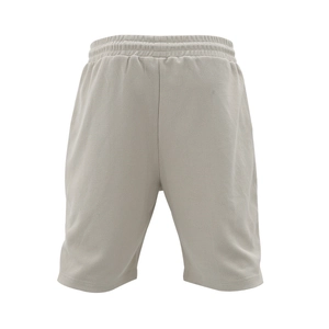 Detailed view of light grey waffle texture sports shorts with elastic waistband