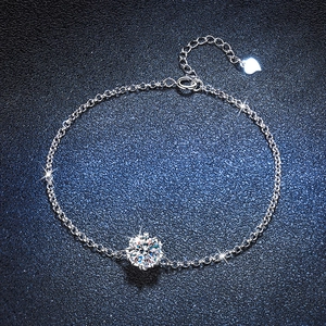 Elegant S925 silver snowflake bracelet with brilliant moissanite stone on blue background