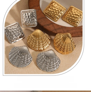 Detail of square hammered texture and shell shape earrings in gold and silver finish
