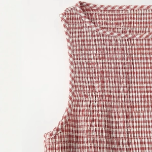 Chic red and white plaid sleeveless midi dress with elegant smocked elastic texture details