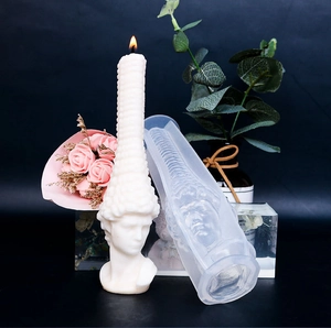 Detail of classical bust silicone mold for DIY candles with a finished lit wax sculpture