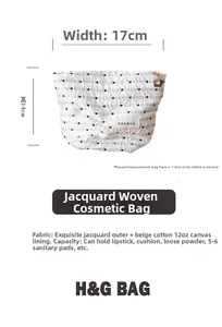 Dettaglio della borsa da trucco a pois con cerniera a stella e larghezza di 17 cm