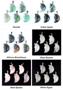 Macro display of diverse carved moon face crystal pendants with silver metal bails