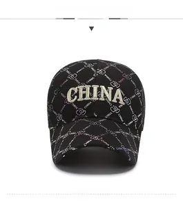 Close-up of black baseball cap with 3D beige CHINA embroidery and crown patterns
