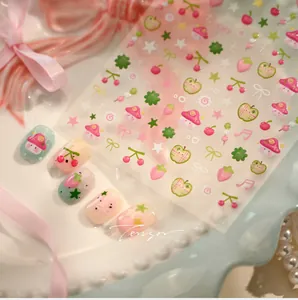 Vue détaillée des stickers ongles M-1124 avec motifs de fruits mignons et faux ongles