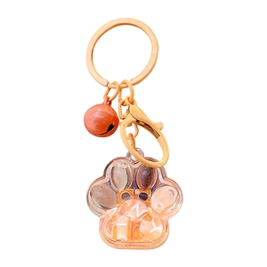 DIY orange cat paw liquid quicksand keychain with bell and floating letter charms