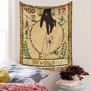 Detail of bohemian tarot world tapestry with As Above So Below mystical symbols on white wall