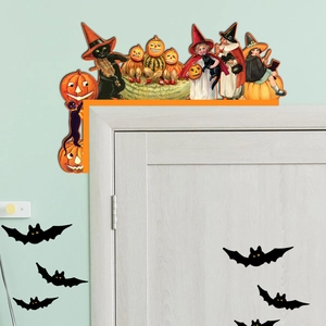 Macro detail of vintage Halloween door corner decor featuring pumpkins, cats and bats