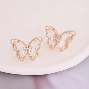 Macro view of gradient butterfly earrings with gold plating and cubic zirconia inlay