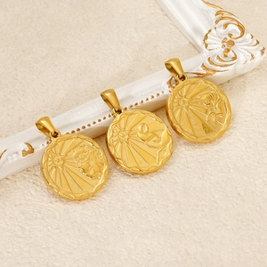 Vintage gold zodiac pendant necklaces with sunburst relief and astrological symbols