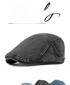 Detailed close-up of a vintage denim beret hat with adjustable metal buckle at the back