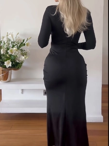 Elegant black long sleeve slim fit maxi dress with a bodycon silhouette and back slit