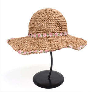 Woven straw sun hat with pink floral lace trim for summer beach vacation and sun protection