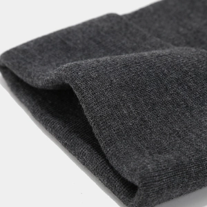 Detailed close-up of dark grey knitted texture and wide brim of the outdoor sun hat