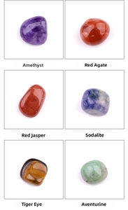 Detailed view of six polished natural yoga stones including Amethyst and Tiger Eye