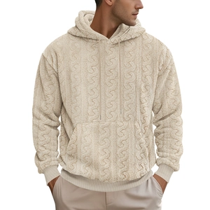 Detail of men's beige sherpa hoodie featuring cable knit texture and kangaroo pocket