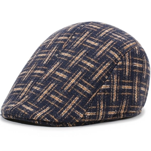 Close-up of blue and brown tweed plaid pattern on classic wool blend driving cap
