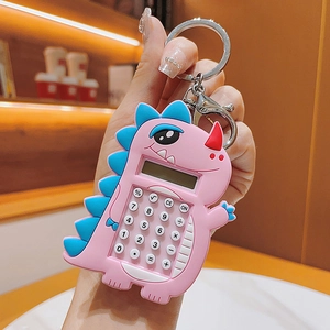 Pink cartoon dinosaur mini calculator keychain with metal hook shown in hand