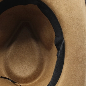 Detailed macro view of internal black sweatband and wool felt texture on cowboy hat