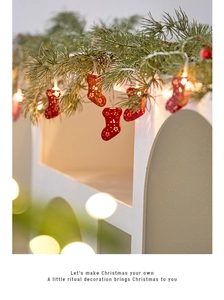 Detail of red hollowed-out stocking LED string lights with snowflake patterns for Christmas