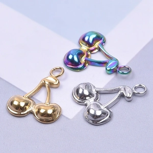 Three metal cherry pendants in gold, silver, and rainbow plating for DIY jewelry making
