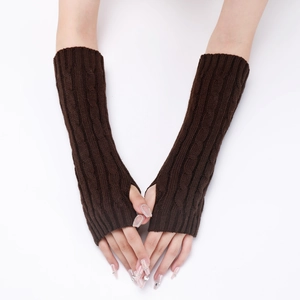 Detailed close-up of dark brown cable knit arm warmers with fingerless design for winter