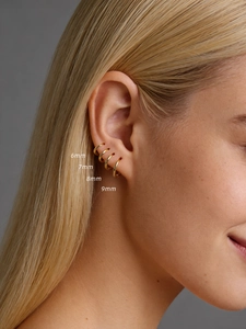 Detail showing 6mm to 9mm gold S925 silver huggie earrings set for multiple piercings