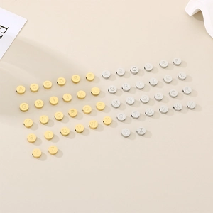 Set of 26 round stainless steel alphabet charms in gold and silver finish for DIY jewelry