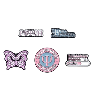5-piece set of psychology themed enamel pins with butterfly and psych text designs