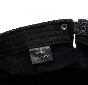 Detail view of the inner label showing 30% wool and 70% polyester fabric composition