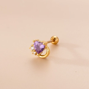 Macro detail of gold helix stud with purple heart zircon and three accent stones
