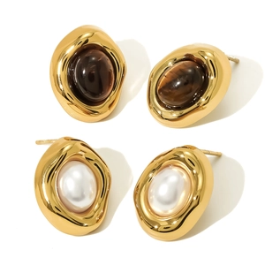 Irregular liquid gold earrings set with tiger eye stones and white pearls in retro style