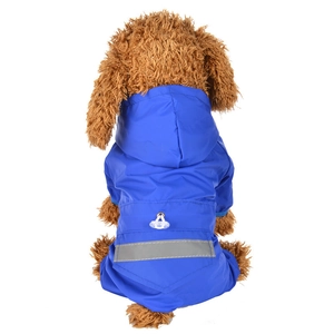 Detail of blue waterproof dog raincoat with reflective safety strip and harness hole